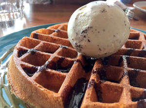 FATCAT's Original Waffle topped with a scoop of Cookies & Cream Ice Cream.
